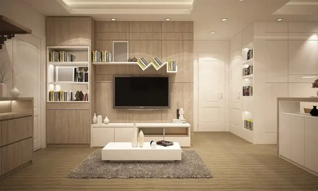a room with a tv and shelves